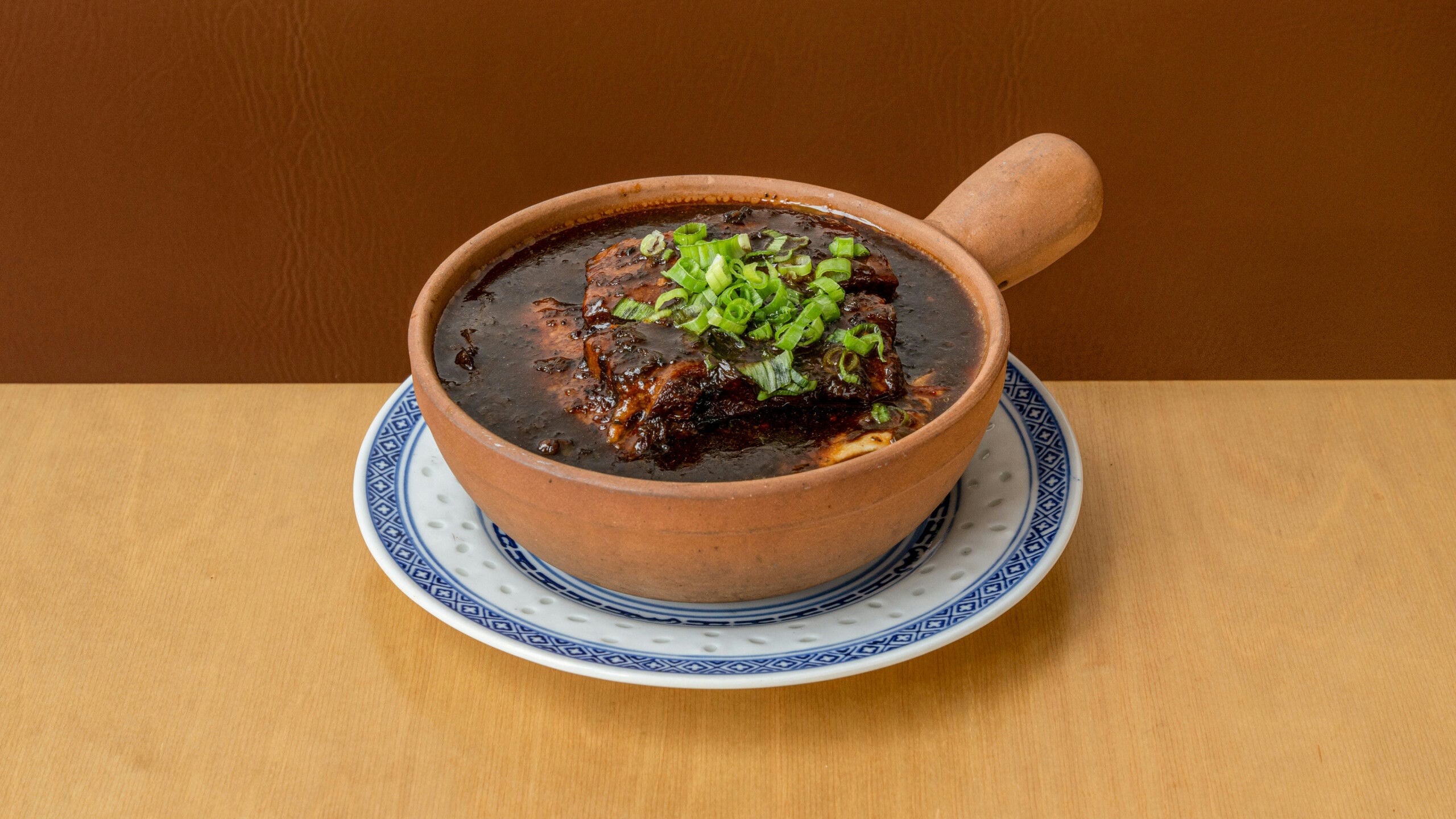 Willow Sliced Pork Belly on Pickled Mustard Green